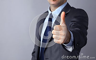 Picture of man hands showing ok sign, isolated on gray background Stock Photo