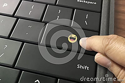 Laugh at somebody or something on the computer Editorial Stock Photo