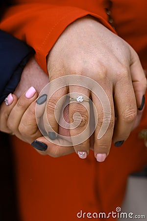 Picture of man and woman hands with wedding ring Stock Photo