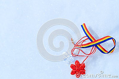 Picture with martisor and romanian tricolor elements on snow white background. Moldavian and Romanian spring symbol. Stock Photo