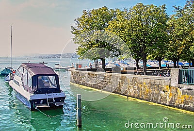 Picture of Motorboat at the pier in sunny day. Stock Photo