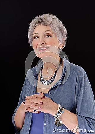 Picture of older woman posing with paua shell stick bar beads Stock Photo