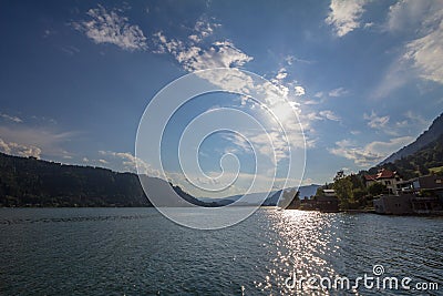 Panorama over ossiacher see lake in summer, at sunset. Ossiachersee, or Ossiach lake, is an alpine see near Villach, in Carinthia, Stock Photo