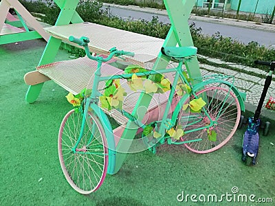 Picture of a pastel candy-colored bicycle in the park Stock Photo