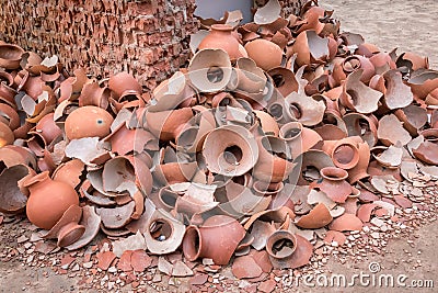 Picture of pile of broken Clay Pottery or Earthenware or traditional Jar on abandoned hut Stock Photo