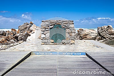 The plate marking the point of Cape Agulhas, the southernmost point of africa. The indian ocean is on the right, the Atlantic Stock Photo