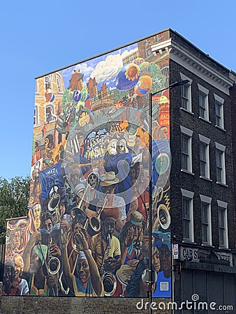 The Dalston Lane Mural, painted in 1985 by Ray Walker. This now iconic image is based on the 1983 Hackney Peace Carnival Editorial Stock Photo