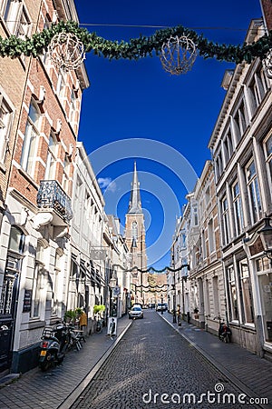 MAASTRICHT, NETHERLANDS - NOVEMBER 10, 2022: Rechstraat street, a pedestrian street of the city center of Maastricht with the Sint Editorial Stock Photo