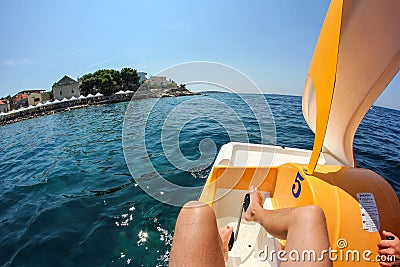 A rented paddle boat floating on the sea Stock Photo