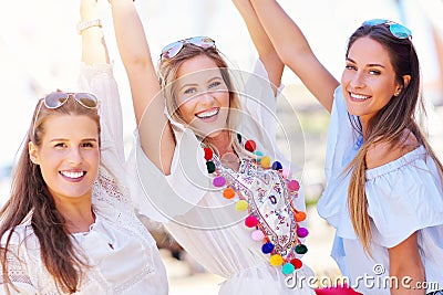 Happy girl friends hanging out in the city in summer Stock Photo