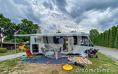 Caravan / Camper at a campside in the evening Stock Photo