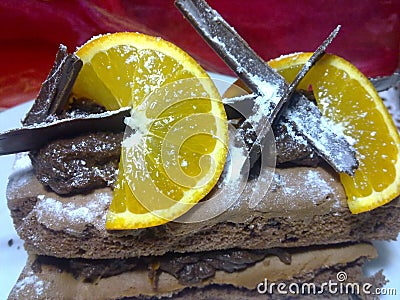 Chocolate pile with chocolate foam and oranges Stock Photo