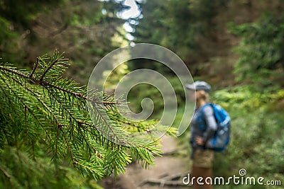 Photo of a happy girl walking along a mountain trail Stock Photo
