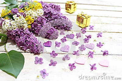 Lilac, sweet alison, snowberry, hearts and gifts Stock Photo