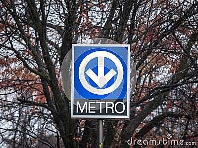 Blue Sign indicating a subway station with its distinctive logo on the Montreal metro system, managed by the STM Editorial Stock Photo