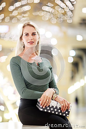Picture of sitting blonde with gift box Stock Photo