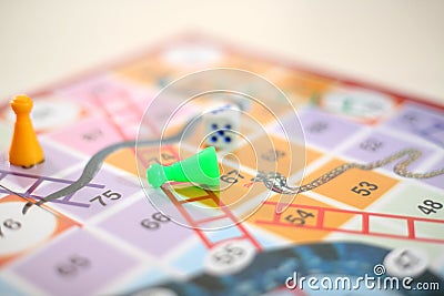 Picture of snakes and Ladders Game with tokens and dice Stock Photo