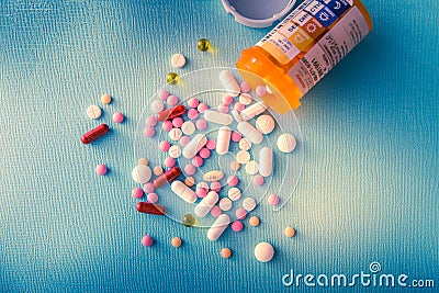 Tablets pills capsule heap mix therapy drugs, antidepressant, antibiotic, painkiller over a blue white background Stock Photo