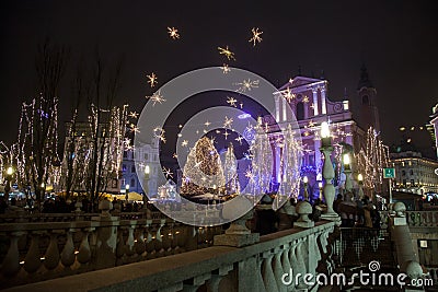 Tromostovje Triple Bridge taken at night during the Christmas period with Christmas decorations. Editorial Stock Photo