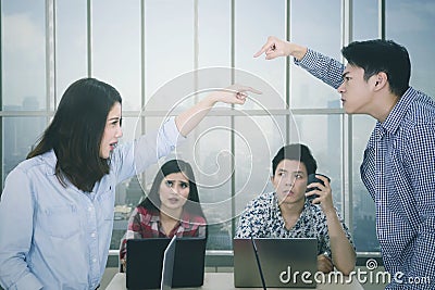 Two workers accusing each other in the meeting Stock Photo