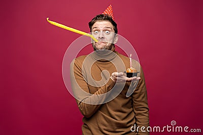 Picture of unhappy stressed young man having unhappy look, feeling tired and worn out with birthday party preparations Stock Photo