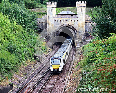 A train leaving Clayton Tower tunnel in Sussex. Editorial Stock Photo