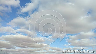 A picture of various clouds at different times of the day during the winter Stock Photo