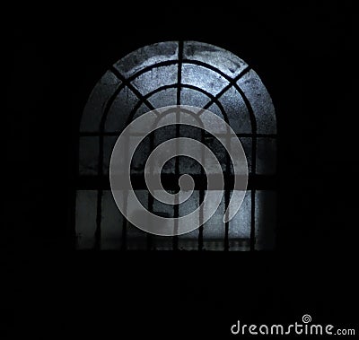 Picture of a window at night time with some creepy lights Stock Photo