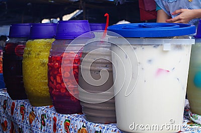Picture of a woman serving Aguas frescas in a Honduras Market Tegucigalpa 2 Stock Photo