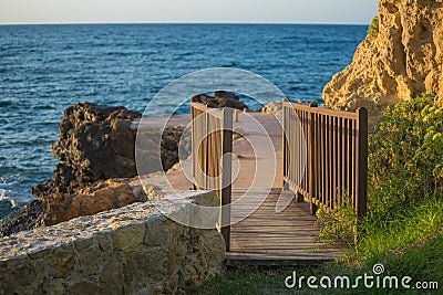 Picture of wooden bridge with blue sea at the background Stock Photo