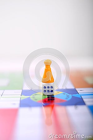 Picture of yellow ludo tokens and dice Editorial Stock Photo