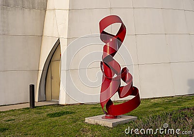 Abstract steel sculpture with red paint by Nic Noblique, front of the Interfaith Peace Chapel, Cathedral of Hope in Dallas, Texas. Editorial Stock Photo