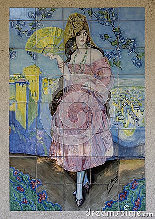 Art piece of painted tiles forming a lovely woman with a fan by A. Bosch in the garden of the Philbrook Museum of Art in Tulsa. Editorial Stock Photo