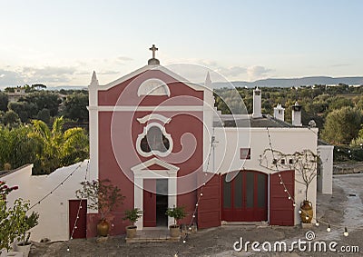 Ancient chapel in the main courtyard of the Masseria Torre Coccaro Stock Photo