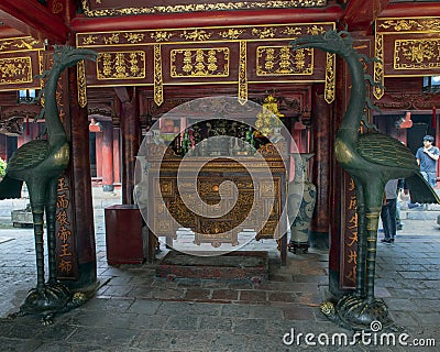 Bronze cranes on turtles in front of Buddhist altar, House of Ceremonies, Temple of Literature, Hanoi, Vietnam Editorial Stock Photo