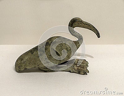 Bronze Egyptian ibis amulet from the Late Period 712-332 BCE on display in the Dallas Museum of Art. Editorial Stock Photo