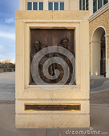 Bronze relief of Enis and Lowe couples by Dan D. Brook in the Founder`s Plaza of Texas Christian University in Fort Worth. Editorial Stock Photo