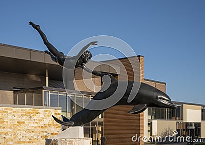 `Boy on a Dolphin` by David Wynne in front of Grayson College, Denison Campus, Texas. Editorial Stock Photo