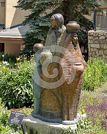 Bronze sculpture titled `Four Generations` by sculptress Felicia Nawa in Beaver Creek, Colorado. Editorial Stock Photo