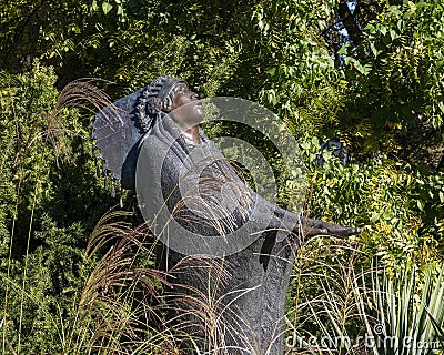 Bronze sculpture titled Prayer by Allan Houser in the garden of the Philbrook Museum of Art in Tulsa, Oilahoma. Editorial Stock Photo