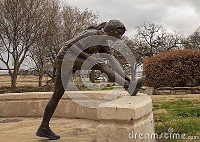 `The Runner` by Glenna Goodacre in Mozart Plaza at the University of North Texas in Denton, Texas. Editorial Stock Photo