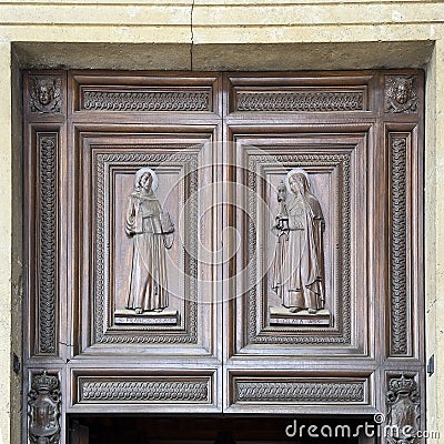 Carved wooden reliefs of Saint Francis and Saint Clare of Assisi at the Papal Basilica of Saint Mary of the Angels. Stock Photo