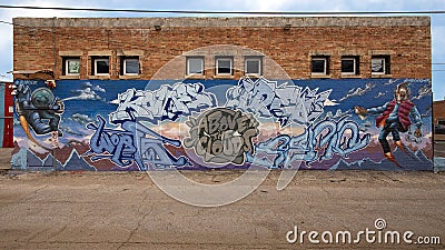 Pictured is a surrealistic mural by @Blindkolor on the back of a building in Deep Ellum in Dallas, Texas. Editorial Stock Photo