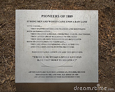 Information for `Pioneers of 1889` by artist Leonard McMurry in downtown Oklahoma City. Editorial Stock Photo