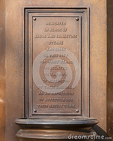 Dedication plaque Sterne Fountain featuring a statue of Hebe in Jefferson, Texas. Editorial Stock Photo