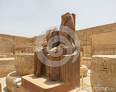 Statue of Ramesses and Maat, Hypostyle Hall past the second court of the Mortuary Temple of Ramesses III in Medina Habu. Editorial Stock Photo