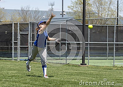 Girl softball pitcher warming up before a game Stock Photo