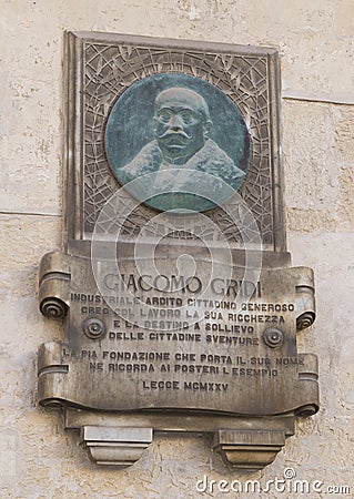 Embossed metal plaque honoring Giacomo Gridi in Lecce, Italy Editorial Stock Photo