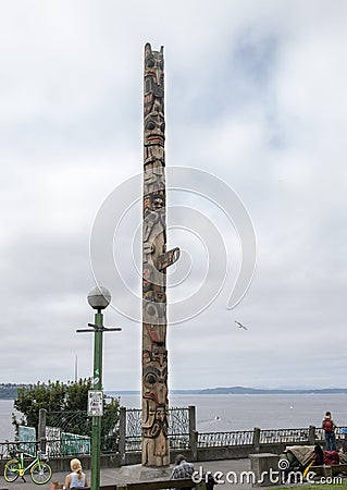 Fifty foot cedar totem pole titled `Untitled` in Victor Steinbrueck Park, Seattle, Washington Editorial Stock Photo