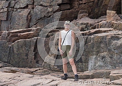 Forty-nine year-old physically fit Caucasian woman on a family vacation in Bar Harbor, Maine. Stock Photo